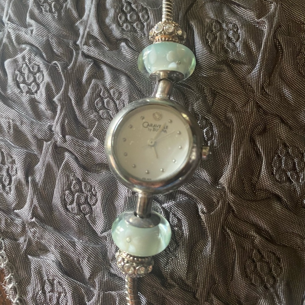 NWOT Caravelle by Bulova Charm Watch -adjustable bracelet. Glass & crystal beads